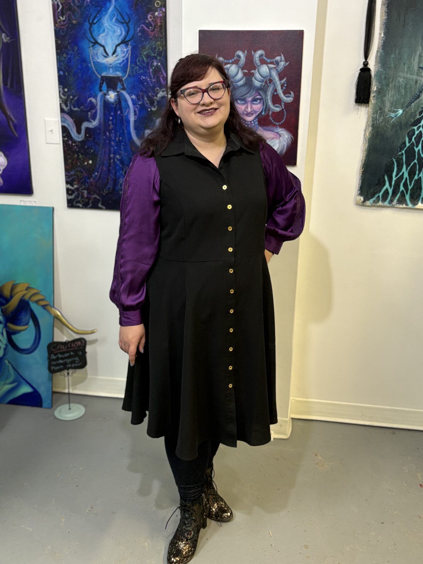Photo of artist Audra Balion posing in her studio